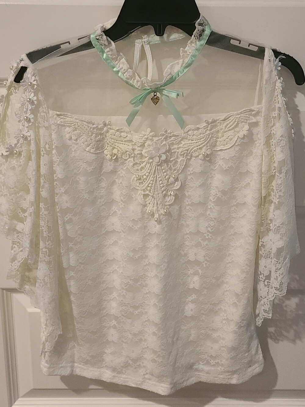 Cream Lace Off-Shoulder Blouse with Floral Appliqué